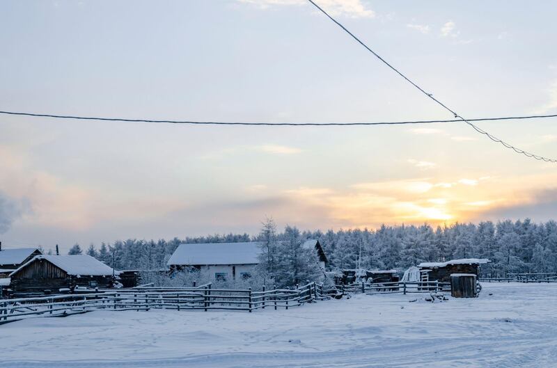 2CAC6FY Winter sunset in one of the coldest places on earth, in the village Oymchkon in the Russian North. Alamy