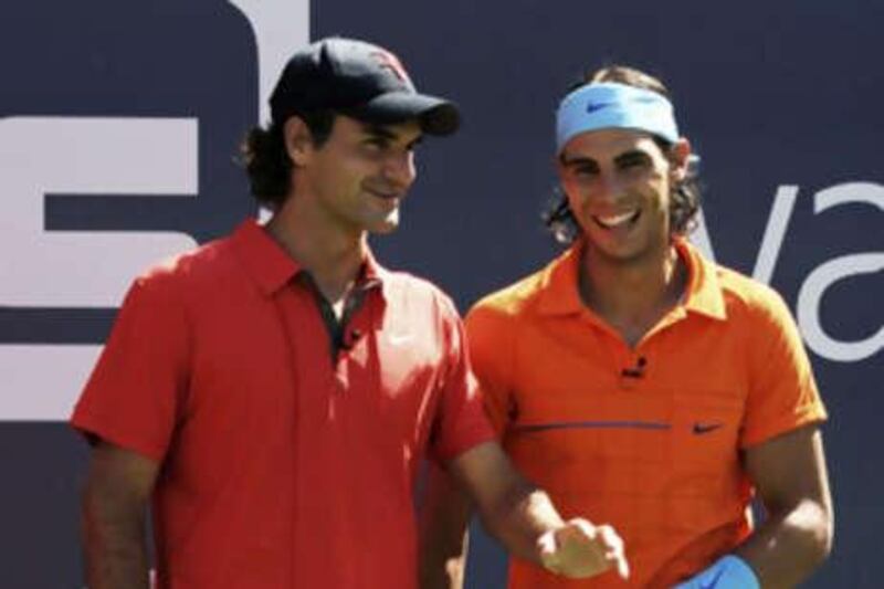 Roger Federer and Rafael Nadal share a laugh during Arthur Ashe Kids' Day prior to the US Open. Can Nadal now steal the US title from Federer?