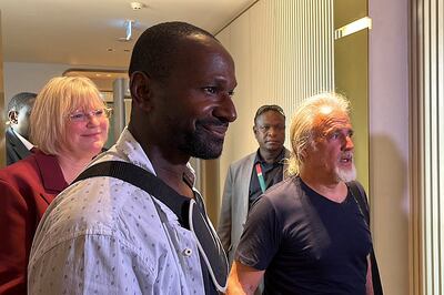 French journalist Olivier Dubois, left, freed after nearly two years, and US citizen Jeffery Woodke arrive at Diori Hamani Airport in Niamey. AFP