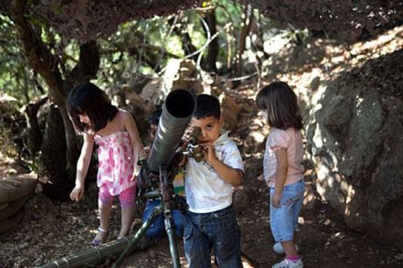 Children get a hands-on view of old Hizbollah equipment, on display to celebrate the group’s  struggle against Israel, at the Mleeta resistance museum in South Lebanon. Philip Cheung