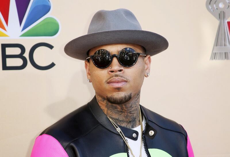 FILE PHOTO: Singer Chris Brown poses at the 2015 iHeartRadio Music Awards in Los Angeles, California, March 29, 2015. REUTERS/Danny Moloshok/File Photo
