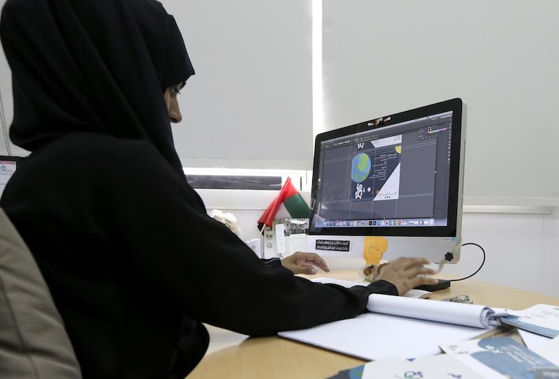 Graphic designer Farhana Hakim at her job at Sharjah City for Humanitarian Services. The hearing-impaired Pakistani says her job allows her to capture her thoughts on paper and wants her work to define her. Her ambiition is to be a graphic-design brand. Jeffrey E Biteng / The National