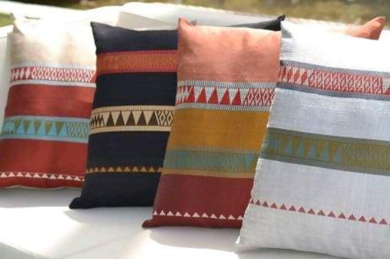 The silk cushions are hand woven at Carol Cassidy's studio in Laos. Courtesy of Zeri Crafts