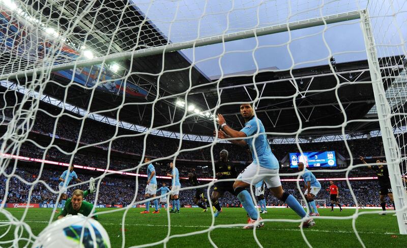 LONDON, ENGLAND - MAY 11:  Goalkeeper Joe Hart and Sergio Aguero of Manchester City look on in vain as the header from Ben Watson of Wigan Athletic hits the back of the net for the match winning goal during the FA Cup with Budweiser Final between Manchester City and Wigan Athletic at Wembley Stadium on May 11, 2013 in London, England.  (Photo by Shaun Botterill/Getty Images)