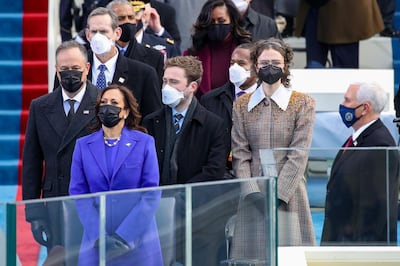 WASHINGTON, DC - JANUARY 20: Doug Emhoff (from left), Vice President Elect Kamala Harris, Cole Emhoff, Ella Emhoff, and Vice President Mike Pence stand as Lady Gaga sings the National Anthem at the inauguration of U.S. President-elect Joe Biden on the West Front of the U.S. Capitol on January 20, 2021 in Washington, DC. During today's inauguration ceremony Joe Biden becomes the 46th president of the United States.   Win McNamee/Getty Images/AFP
== FOR NEWSPAPERS, INTERNET, TELCOS & TELEVISION USE ONLY ==
