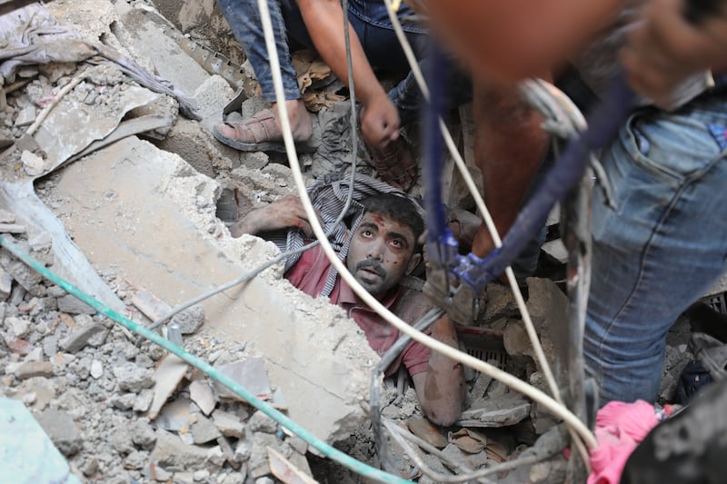 A survivor is found in the rubble in Nusseirat. AP