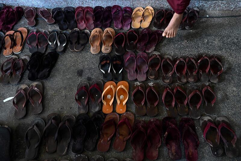 Footwear is seen as Buddhist monks, nuns, and members of the ultra-nationalist group Ma Ba Tha attend the group's annual meeting in Yangon, Myanmar. AFP