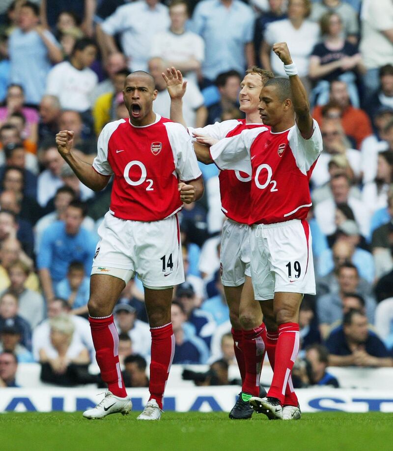 LONDON - APRIL 25:  Thierry Henry of Arsenal celebrates with team-mates Gilberto and Ray Parlour after the first goal during the FA Barclaycard Premiership match between Tottenham Hotspur and Arsenal at White Hart Lane on April 25, 2004 in London.  (Photo by Shaun Botterill/Getty Images)