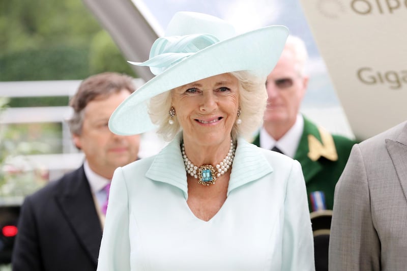Camilla, Duchess of Cornwall worn matching eau de nil for the  presentation of the Prince of Wale's Stakes at Royal Ascot. Getty