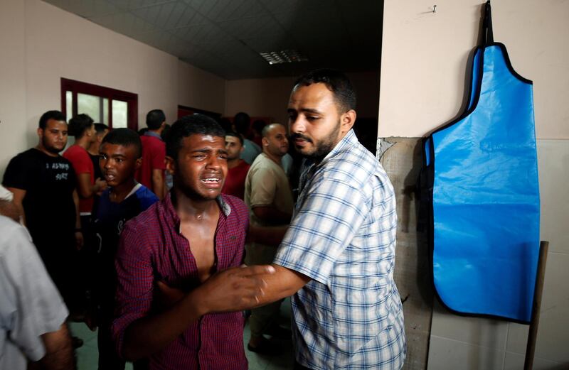 A relative of a Palestinian Hamas militant who was killed in Israeli tank shelling, reacts at a hospital in the northern Gaza Strip, August 7, 2018. REUTERS/Mohammed Salem