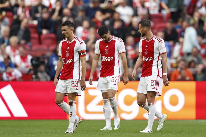 Steven Berghuis, Josip Sutalo, and Branco van den Boomen, left to right, of Ajax during the Dutch Eredivisie soccer match between Ajax and Feyenoord. EPA