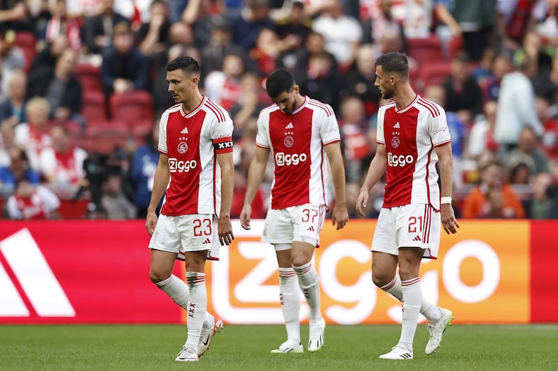 Steven Berghuis, Josip Sutalo, and Branco van den Boomen, left to right, of Ajax during the Dutch Eredivisie soccer match between Ajax and Feyenoord. EPA