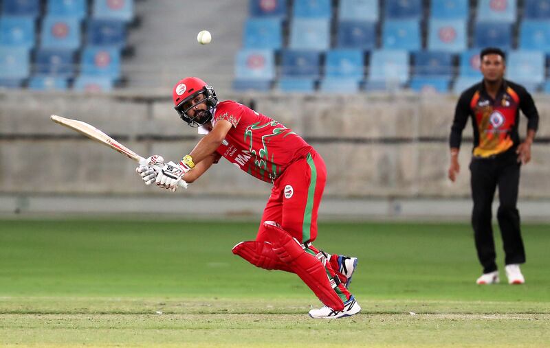 Jatinder Singh of Oman plays a shot on his way to 118 not out in the Cricket World Cup League 2 match against Papua New Guinea at Dubai International Cricket Stadium in Dubai. All photos Pawan Singh / The National 