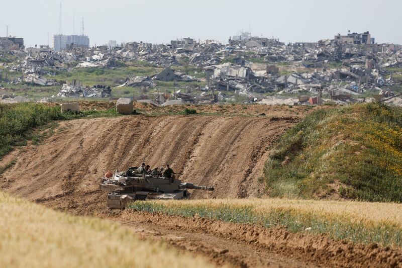 An Israeli tank holds a position near the Israel-Gaza border. Reuters