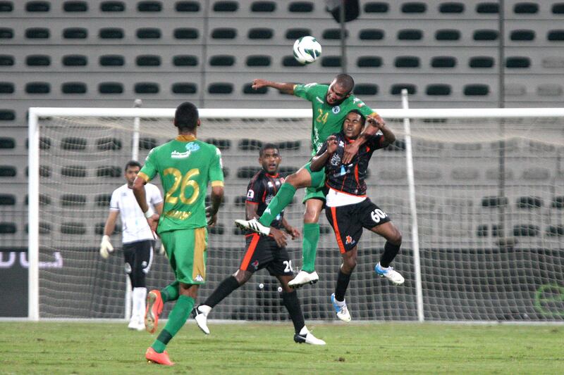 Dubai, United Arab Emirates, Nov 12, 2012 -  Essa Obaid (top) from Al Shabab fight for the ball against  Adil Salem (below) from Ajman at Shabab's Maktoum Bin Rashid Al Maktoum Stadium. ( Jaime Puebla / The National Newspaper )