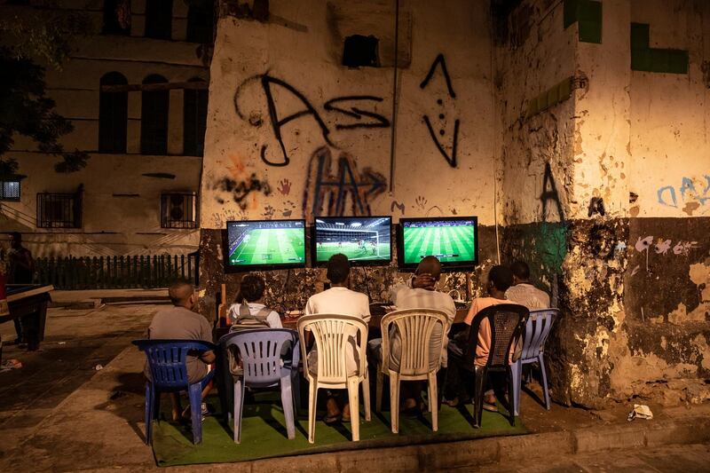 Boys play a video game in the old city of Jeddah, Saudi Arabia. EPA