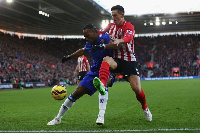 Chelsea's Didier Drogba, left, battles with Florin Gardos of Southampton for the ball during their 1-1 Premier League draw on Sunday at St Mary's Stadium. Michael Steele / Getty Images / December 28, 2014 