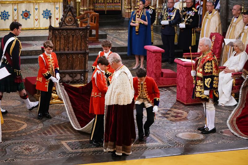 Prince George, left, with King Charles in Westminster Abbey. PA