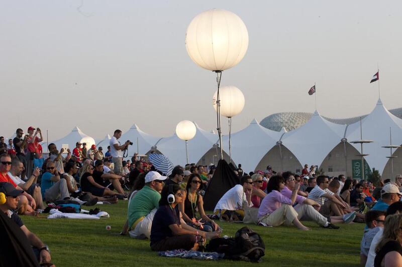 Crowds enjoying the Formula 1 Etihad Airways Abu Dhabi Grand Prix at the Abu Dhabi Hill area during the Qualifying Races.  Razan Alzayani / The National