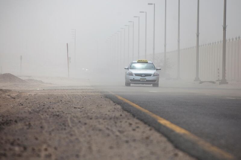 Abu Dhabi, United Arab Emirates, March 21, 2013: 
A taxi makes its way through a wall of dust as gusty winds brought rain and low visibility to the day on Thursday, March 21, 2013, near the Al Bateen Airport in Abu Dhabi.
Silvia Razgova / The National

