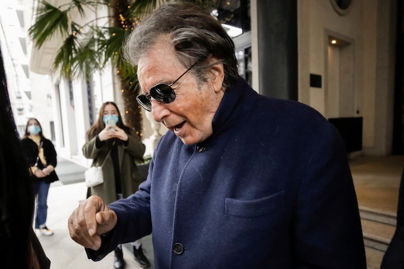 FILE - Al Pacino, who plays Aldo Gucci in Ridley Scott's movie based on the story of the murder of Maurizio Gucci in 1995, being filmed mainly in Milan and Rome, leaves Palazzo Parigi in Milan, Italy, Thursday, March 11, 2021. The great-grandchildren of Guccio Gucci, who founded the luxury brand nearly a century ago in Florence, are appealing to filmmaker Ridley Scott to respect their familyâ€™s legacy in the film that focuses on the sensational murder. (AP Photo/Luca Bruno)