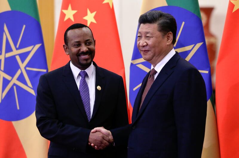 BEIJING, CHINA - SEPTEMBER 2: Ethiopia's Prime Minister Abiy Ahmed, (L) shakes hands with Chinese President Xi Jinping before their bilateral meeting at the Great Hall of the People on September 2, 2018 in Beijing, China. (Photo by Andy Wong - Pool/Getty Images)