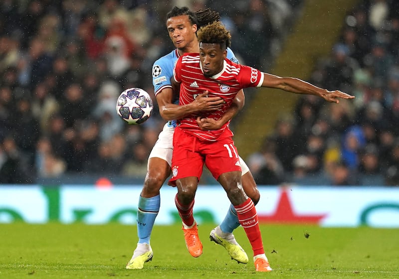 Manchester City's Nathan Ake and Bayern Munich's Kingsley Coman battle for the ball. PA