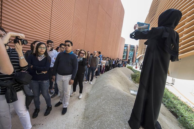 The UAE pavilion, shaped like shimmering sand dunes surrounded by native plants attracted the attention of camera-wielding tourists. Giuseppe Aresu / The National