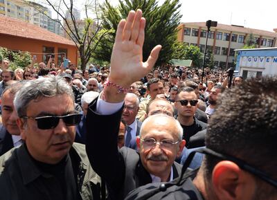 Kemal Kilicdaroglu salutes supporters at a polling station in Ankara on Sunday. AP