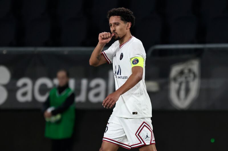 PSG's Marquinhos celebrates scoring the third. AP