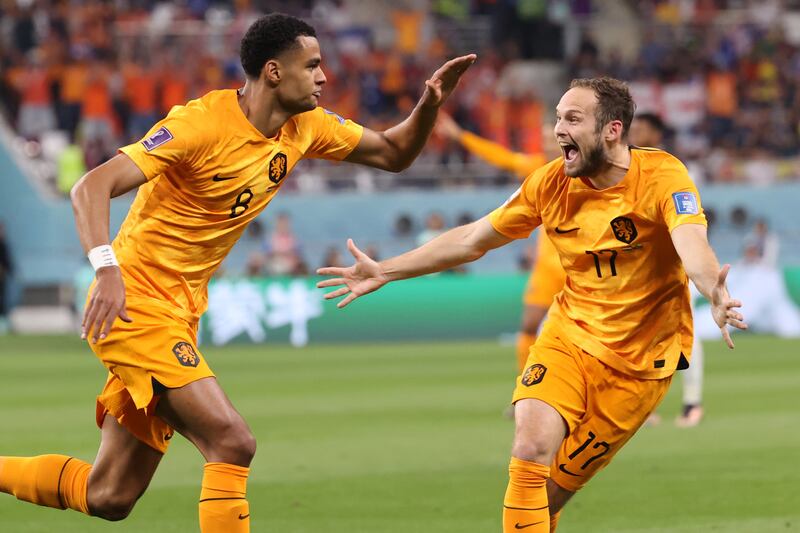 Netherlands' Cody Gakpo celebrates with Daley Blind after scoring the opening goal. EPA