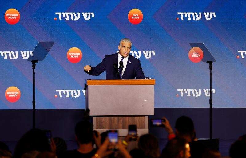 Prime Minister Yair Lapid addresses supporters at his campaign headquarters in Tel Aviv. EPA