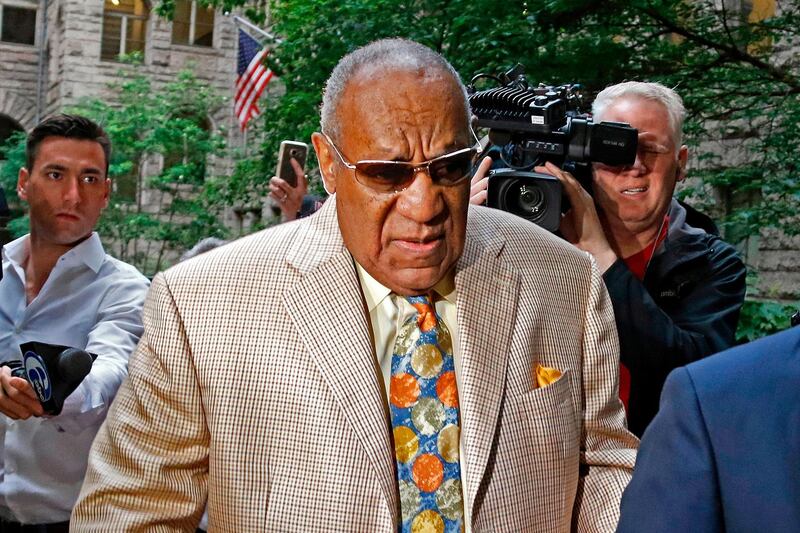 FILE â€“ In this May 22, 2017, file photo, Bill Cosby, center, arrives for jury selection in his sexual assault case at the Allegheny County Courthouse in Pittsburgh. The trial ended with a deadlocked jury. Cosby's retrial was set to begin Monday, April 9, 2018, on charges he drugged and sexually assaulted Andrea Constand in 2004 at his home near Philadelphia, after selection of jurors in the first week of April. (AP Photo/Gene J. Puskar, File)