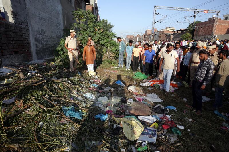 epa07106377 Police officers inspect at the site of a train accident in Amritsar, India, 20 October 2018. According to reports, at least 60 people were killed when a train ran over a crowd that was watching the burning of Ravana effigy during Dusshera celebrations on 19 October 2018.  EPA/RAMINDER PAL SINGH