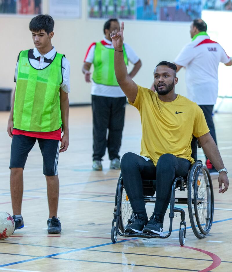 Former Emirati footballer Ahmed Al Akberi while training the deaf football team at Zayed Higher Organization for People of Determination. He is the first disabled athlete to receive an AFC accreditation to become a sports coach.