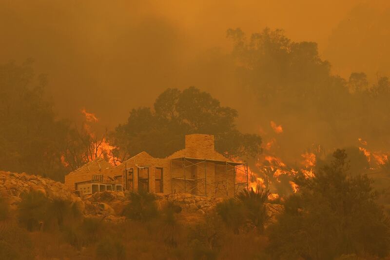 Flames surround a property under construction off Copley Road in Upper Swan in Perth, Australia. Getty Images