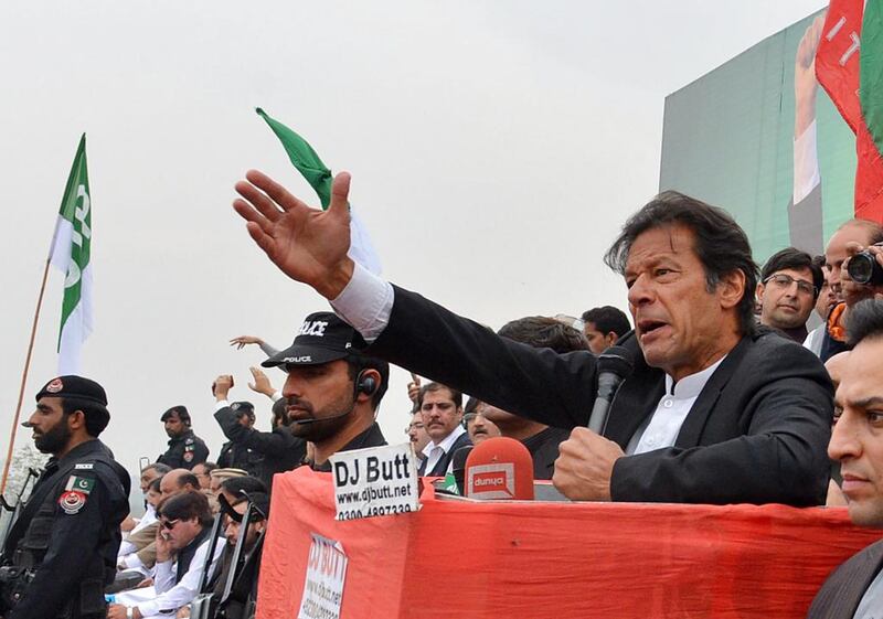 Imran Khan, Chairman of Pakistan Tehreek-e-Insaaf (PTI) party, addresses a protest rally in Peshawar on November 23, 2013. A Majeed / AFP Photo


