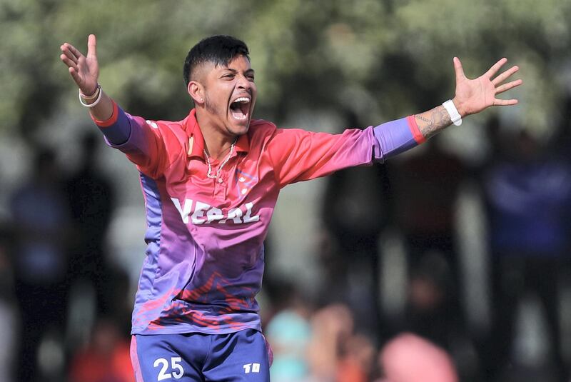 Dubai, United Arab Emirates - January 26, 2019: Sandeep Lamichhane of Nepal takes the wicket of Chundangapoyil Rizwan of the UAE in the the match between the UAE and Nepal in a one day internationl. Saturday, January 26th, 2019 at ICC, Dubai. Chris Whiteoak/The National