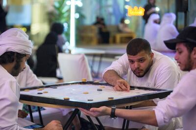 Play in karom tournaments at the Ramadan Arcade. Courtesy Manarat Al Saadiyat 