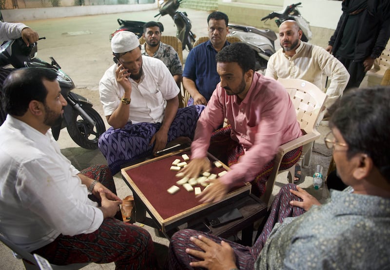 Men playing dominos after taraweeh prayers in Barkas
