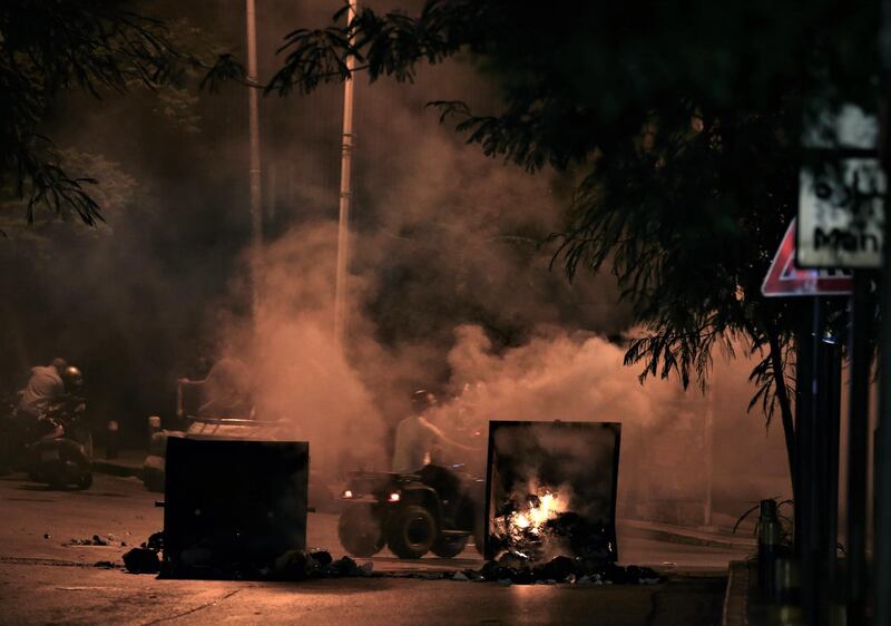 Anti-government protestors have garbage bins set on fire to block a road during a protest over deteriorating living conditions  in Beirut, Lebanon.  EPA