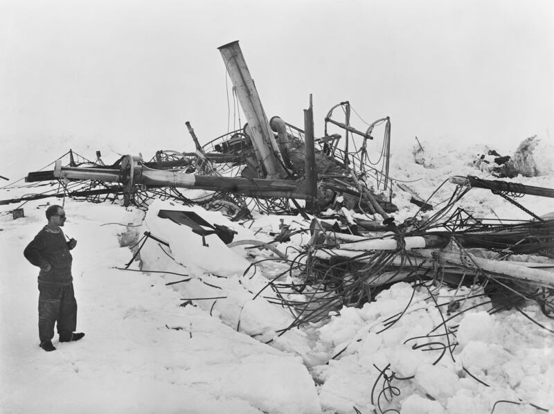 Frank Wild looks at the wreck of the 'Endurance' in the Antarctic.
