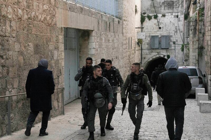 Israeli border police on patrol in Jerusalem's Old City as Palestinians walk to Al Aqsa Mosque compound for prayers on Sunday. AP