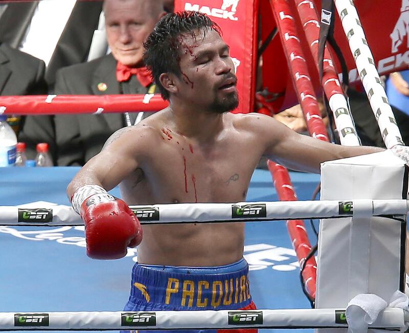 FILE - In this July 23, 2017, file photo, Manny Pacquiao, of the Philippines, reacts after his loss to Jeff Horn, of Australia, in a WBO World Welterweight title fight in Brisbane, Australia. Pacquiao won't box Horn in a rematch of their WBO world welterweight title fight this year because the Filipino senator will be busy with government duties. Pacquiao's unavailability for a proposed Nov. 12 bout was announced Friday, Sept. 1, 2017, by Australian promoters of the fight. (AP Photo/Tertius Pickard, File)