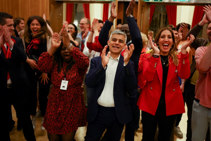 London Mayor Sadiq Khan celebrates during the counting process at Wandsworth Town Hall in London. Reuters