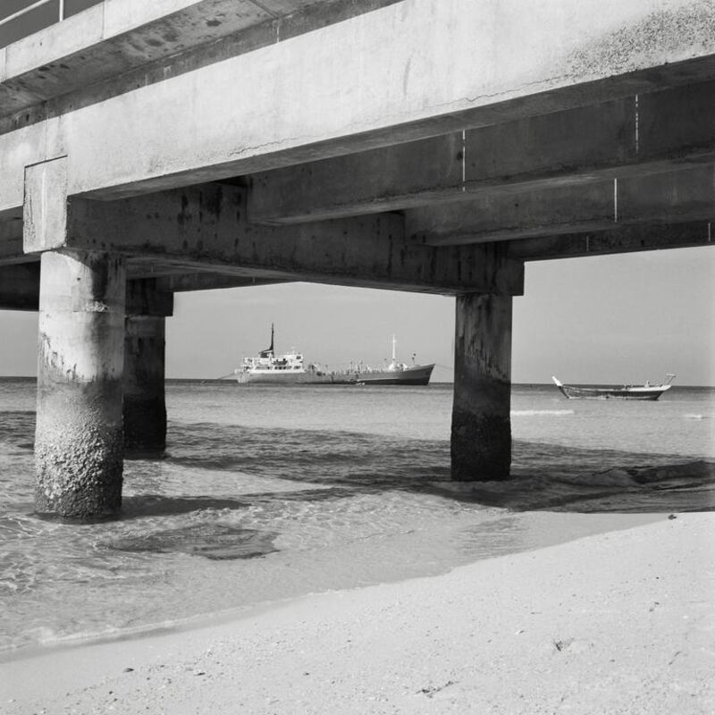 Tanker Framed by Khalid Port Bridge, Sharjah, 1960sThe Water series © Noor Ali Rashid Archives