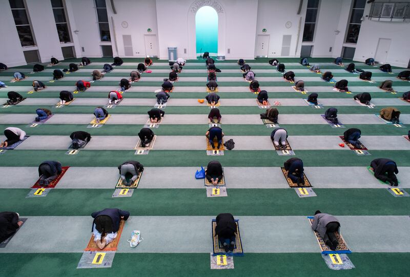 Worshippers observe social distancing during the Isha evening prayers at Baitul Futuh Mosque, in Morden, south-west London, on the last day of Ramadan in 2021