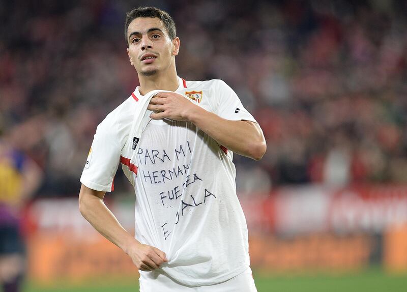 Sevilla's Wissam Ben Yedder shows a t-shirt supporting Cardiff City FC's Emiliano Sala, as he celebrates scoring his team's second goal in Seville, Spain. AFP