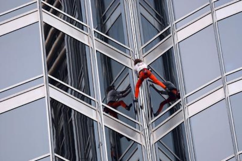 Dubai , United Arab Emirates- March, 28,  2011:  French 'Spiderman' Alain Robert  climbs the world's Tallest building  Burj Khalifa in Dubai . ( Satish Kumar / The National ) 