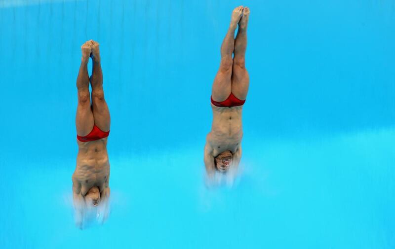 Francesco Dell'uomo and Maicol Verzotto of Italy make a synchronised dive at the Fina Diving World Series 2014 at the Hamdan Sports Complex. Warren Little / Getty Images  